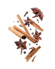 Dry various spices for making mulled wine in the air isolated on a white background