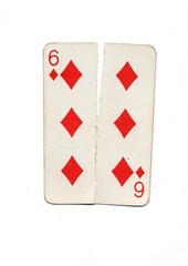 Obraz premium A vintage playing card torn in half from top to bottom on a white background.