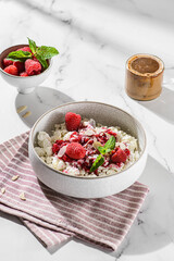 cottage cheese with raspberries and almond petals
