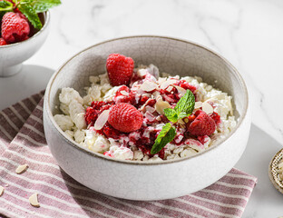 cottage cheese with raspberries and almond petals