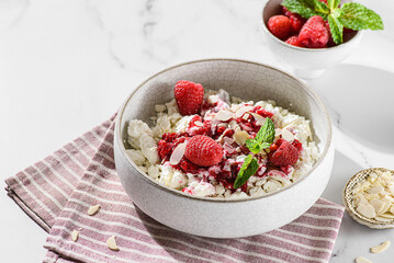 cottage cheese with raspberries and almond petals