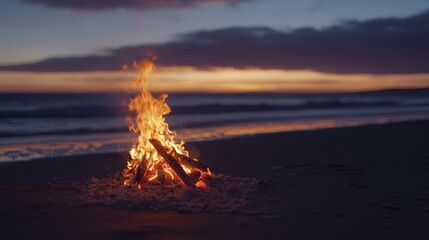 Fototapeta premium Cozy bonfire on the beach at sunset, warm and relaxing outdoor experience