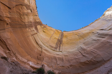 Looking up from colorful canyon in New Mexico under blue sky