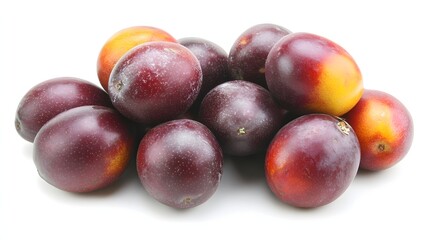 Obraz premium Fresh Ripe Purple Plums Piled Together on a White Background Showing Natural Texture