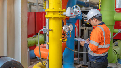 Petrochemical engineer working at petroleum oil refinery industry area. Industrial technician...