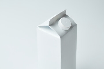 Simple White Carton With a Screw Top on a Light Background in a Clean and Minimal Setting