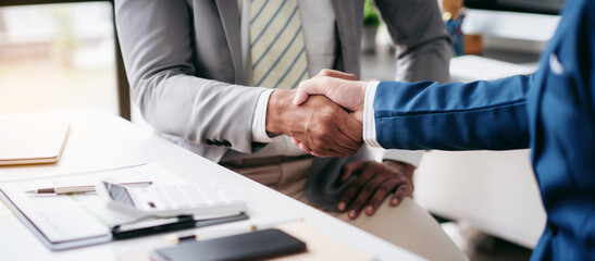 Two men shaking hands in a business meeting