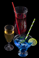 Pouring liquid into a cocktail glass at a party