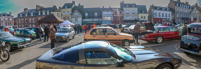 Car enthusiasts gather in town square for an event