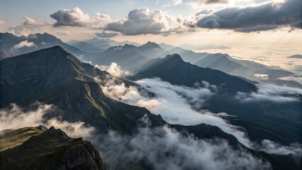 Aerial View of Mysterious Mountains with Low Clouds and Dramatic Lighting
