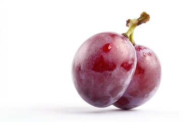 Obraz premium Close-up of two plums on a white surface, perfect for food photography or still life compositions