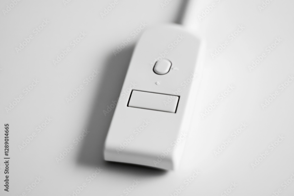 Aufkleber close-up shot of a remote control on a table, useful for product photography and illustration purpos