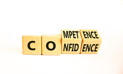Competence and confidence symbol. Concept word Competence Confidence on wooden cubes. Beautiful white table white background. Business competence confidence concept. Copy space.