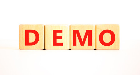 Demo symbol. Concept word Demo on beautiful wooden blocks. Beautiful white table white background....