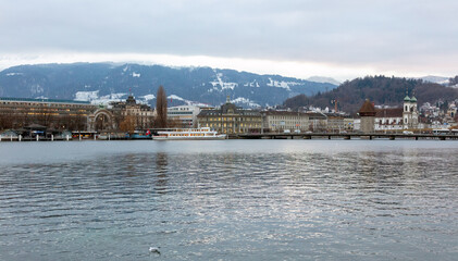 Naklejka premium Switzerland, Lucerne city architecture. Jesuit Church and other historic buildings on Reuss Riverbanks.