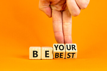 Motivational be your best symbol. Concept words Be your best on beautiful wooden block. Beautiful orange background Businessman hand. Business motivational be your best concept. Copy space.