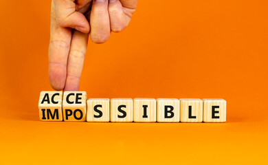 Accessible or impossible symbol. Concept words Accessible or Impossible on beautiful wooden blocks....