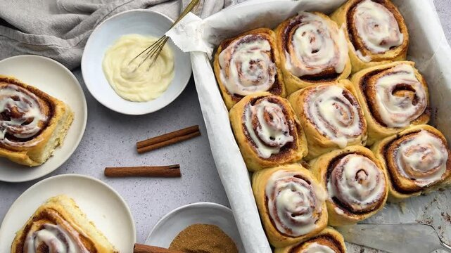Freshly baked cinnamon rolls covered with icing