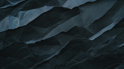 Fototapeta premium Black rumpled paper texture for creative design and background use