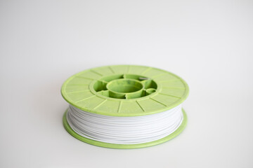 3D printer plastic filament spool, technology concept.
