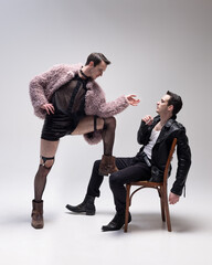 Inner monologue. Dynamic interaction between two versions of self in different stylish outfits,...