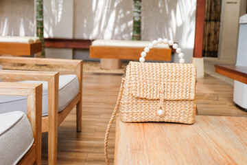 Rattan bag on wooden table,Straw bags or wicker bags,wicker baskets made of natural material,vintage weave wicker baskets,space for sale,copy space.	