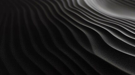Fototapeta premium Close-up shot of flowing dark sand patterns, showcasing graceful lines and curves that evoke a sense of calm and tranquility in nature.