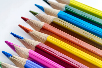 Fototapeta premium A set of colorful pencils neatly arranged and isolated on a white background