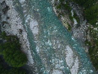 view of a stormy mountain river from above, aerial view