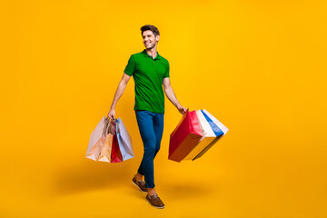 Full length body size view of his he nice attractive cheerful cheery glad content guy carrying new...