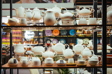 Collection of porcelain and ceramic tableware, crockery on sale for a restaurant of hotel business.