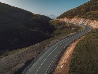 asphalt road through the pass, road high in the mountains, aerial view