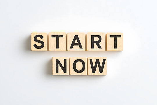 Motivational Message: "Start Now" displayed in wooden blocks on a crisp white background, symbolizing initiative and immediate action.