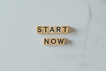 Inspirational message with wooden blocks spelling 'START NOW'. A reminder for motivation, productivity, and taking initiative. Act without delay.