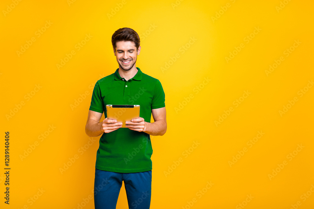 Poster portrait of his he nice attractive focused cheerful cheery guy using reading ebook isolated over bri