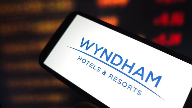 Konskie, Poland - February 22, 2025: Wyndham Hotels and Resorts company logo displayed on mobile phone