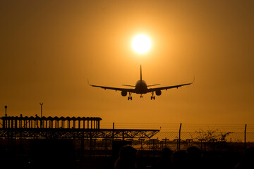Fototapeta na wymiar Silhouette of a plane landing