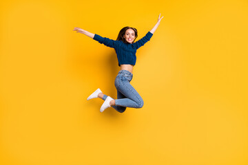 Full length photo of lovely girl smiling raising her arms smiling wearing marsala pullover isolated...