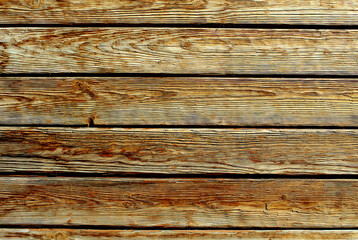 Texture of a wooden plank lying along	