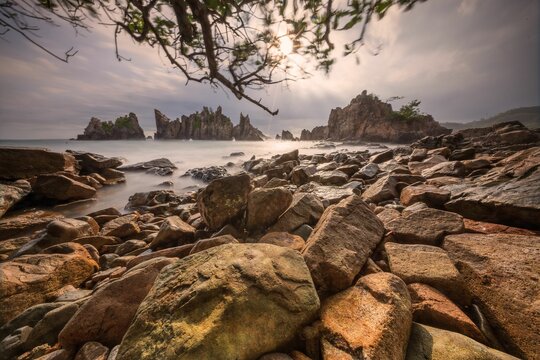 Landscape and seascape of rocky beach at Shark Tooth Beach Kelumbayan Lampung