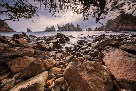 Landscape and seascape of rocky beach at Shark Tooth Beach Kelumbayan Lampung