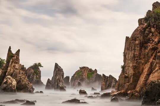 Landscape and seascape of rocky beach at Shark Tooth Beach Kelumbayan Lampung