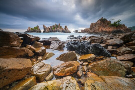 Landscape and seascape of rocky beach at Shark Tooth Beach Kelumbayan Lampung