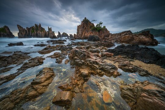 Landscape and seascape of rocky beach at Shark Tooth Beach Kelumbayan Lampung