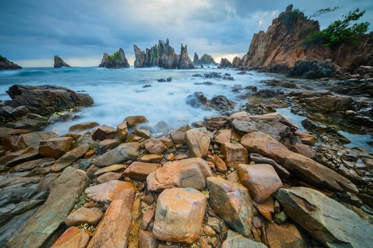 Landscape and seascape of rocky beach at Shark Tooth Beach Kelumbayan Lampung
