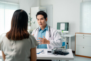 Medical professional checking patient health using oximeter and blood pressure gauge during clinical consultation in hospital setting