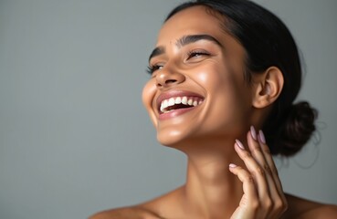 Happy young indian woman with perfect beaming skin. Attractive girl smiles. Beautiful healthy teeth, cosmetic skin care, spa wellness, aesthetic cosmetology. Natural clean fresh radiant face look.