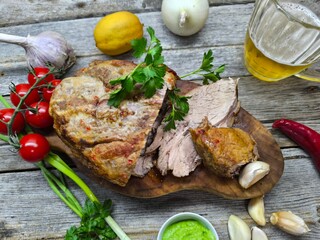 the tenderest fried piece of meat lies on a sliced board