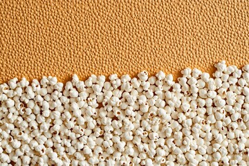 Fototapeta premium Close-up view of popcorn kernels with rich texture, showing the crunchy details of a beloved cinema treat, suitable for food and lifestyle themes, comic book illustration style