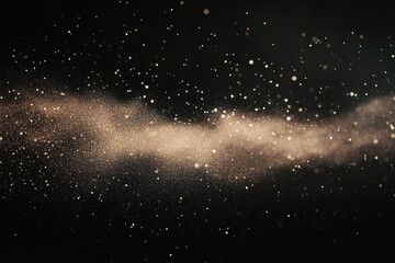 Fototapeta premium Illuminated Dust Particles in Motion Against a Dark Backdrop